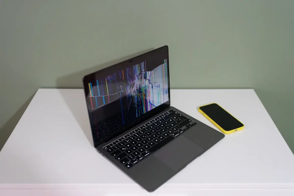 Laptop screen showing code with black line reflection, illustrating what causes black lines on laptop screen